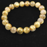 ゴールドルチルクォーツ AAAA 9.5mm玉ブレスレット 25.7g (ID:10805)