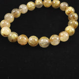 ゴールドルチルクォーツ AAAA 9.5mm玉ブレスレット 25.7g (ID:10805)