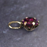 パープルガーネット 5mmラウンド ペンダントトップ チャーム K18YG  0.69ct (ID:14387)