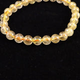 ゴールドタイチンルチルクォーツ 3A 7mm玉ブレスレット 13.2g (ID:14930)