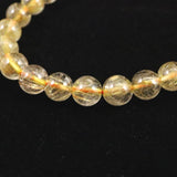 ゴールドタイチンルチルクォーツ 3A 7mm玉ブレスレット 13.2g (ID:14930)