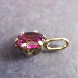 パープルガーネット 5mmラウンド ペンダントトップ チャーム K18YG  0.69ct (ID:25428)