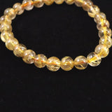 ゴールドタイチンルチルクォーツ 3A 7mm玉ブレスレット 13.0g (ID:31042)
