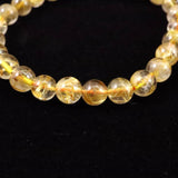 ゴールドタイチンルチルクォーツ 3A 7mm玉ブレスレット 13.0g (ID:31042)