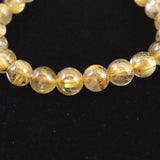ゴールドタイチンルチルクォーツ 3A 8mm玉ブレスレット 17.1g (ID:31504)