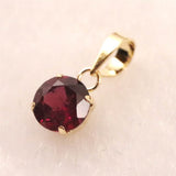 ロードライトガーネット 5mmラウンド ペンダントトップ チャーム K18YG  0.63ct (ID:35103)