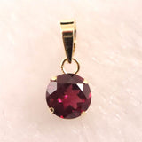 ロードライトガーネット 5mmラウンド ペンダントトップ チャーム K18YG  0.63ct (ID:35103)