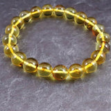 天然琥珀 バルティックアンバー 虫入り　アンバー  9.5mm玉ブレスレット 10.2g (ID:39047)