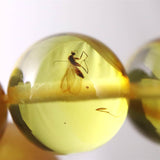 天然琥珀 バルティックアンバー 虫入り　アンバー  9.5mm玉ブレスレット 10.2g (ID:39047)