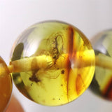 天然琥珀 バルティックアンバー 虫入り　アンバー  9.5mm玉ブレスレット 10.2g (ID:39047)