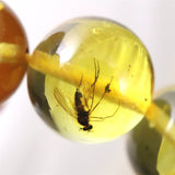 天然琥珀 バルティックアンバー 虫入り　アンバー  9.5mm玉ブレスレット 10.2g (ID:39047)