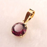 ロードライトガーネット 5mmラウンド ペンダントトップ チャーム K18YG  0.63ct (ID:46625)