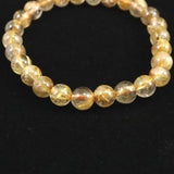 ゴールドタイチンルチルクォーツ AAA 7mm玉ブレスレット 13.1g (ID:53880)