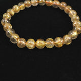 ゴールドタイチンルチルクォーツ AAA 7mm玉ブレスレット 13.1g (ID:53880)