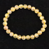 ゴールドタイチンルチルクォーツ 3A 7mm玉ブレスレット 13.1g (ID:55680)