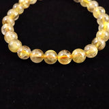 ゴールドタイチンルチルクォーツ 3A 7mm玉ブレスレット 13.1g (ID:55680)