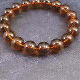 天然琥珀 ミャンマー産 レッドブルーアンバー  10.5mm玉ブレスレット 12.1g (ID:86301)