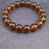 天然琥珀 ミャンマー産 レッドブルーアンバー  10.5mm玉ブレスレット 12.1g (ID:86301)