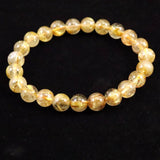 ゴールドタイチンルチルクォーツ AAA 8mm玉ブレスレット 17.3g (ID:91649)