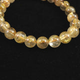 ゴールドタイチンルチルクォーツ AAA 8mm玉ブレスレット 17.3g (ID:91649)