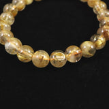 ゴールドタイチンルチルクォーツ AAA 8mm玉ブレスレット 17.3g (ID:91649)