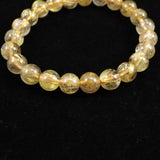 ゴールドタイチンルチルクォーツ AAA 8mm玉ブレスレット 17.4g (ID:93053)