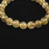 ゴールドタイチンルチルクォーツ AAA 8mm玉ブレスレット 17.4g (ID:93053)