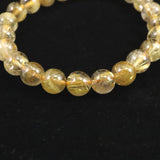 ゴールドタイチンルチルクォーツ AAA 8mm玉ブレスレット 17.4g (ID:93053)