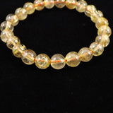 ゴールドタイチンルチルクォーツ AAAA 8mm玉ブレスレット 17.3g (ID:95617)
