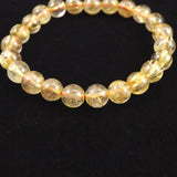 ゴールドタイチンルチルクォーツ AAAA 8mm玉ブレスレット 17.3g (ID:95617)