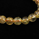 ゴールドタイチンルチルクォーツ AAAA 8mm玉ブレスレット 17.3g (ID:95617)