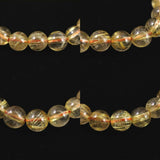 ゴールドタイチンルチルクォーツ AAAA 8mm玉ブレスレット 17.3g (ID:95617)